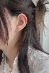 14k knotted ribbon piercing 21G