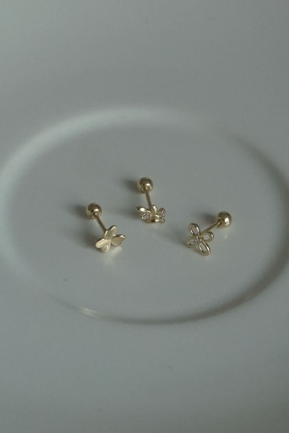 14k line cubic flower piercing 21G